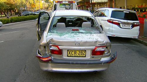 Two people injured after car smashed into Sydney shop