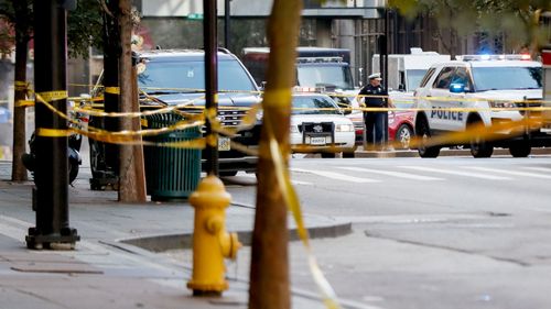 An area cordoned off with police tape after a shooting near Fountain Square in downtown Cincinnati.