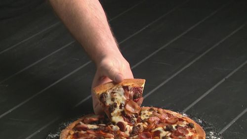 A Queensland man has been chosen as Domino's next pizza hand model after a nationwide search.