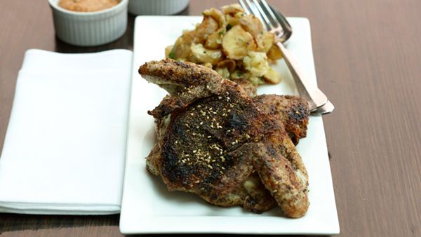 Za'atar-roasted whole baby chicken with lemon and garlic baked potatoes