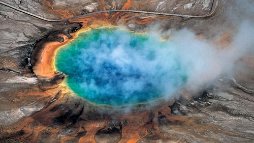 This undated photo provided by Robert B. Smith shows the Grand Prismatic hot spring in Yellowstone National Park's that is among the park's myriad hydrothermal features created by the fact that Yellowstone is a supervolcano, the largest type of volcano on Earth. (Robert B Smith via AP)