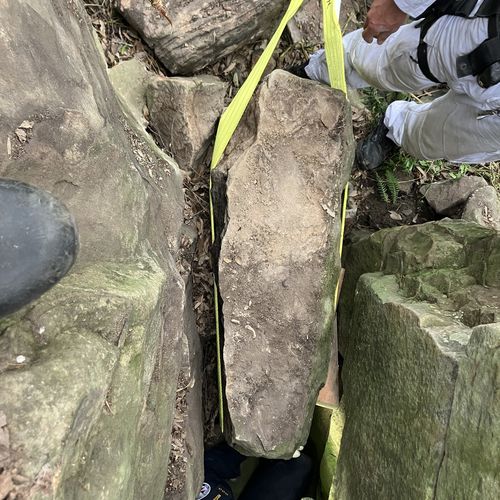 Woman stuck between two boulders in NSW