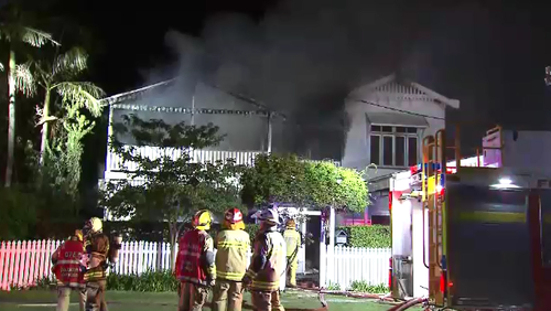 Fire guts inner-Brisbane Queenslander, threatened neighbours