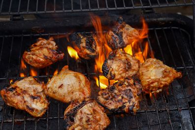 Chicken cooking on a BBQ