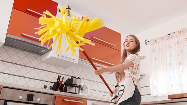 Kitchen duty: If you say that one more time I'm going to hit you with this mop. Image: Getty
