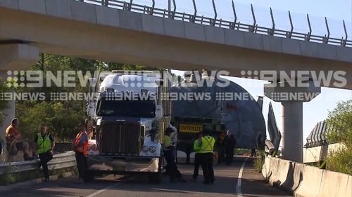 Specialist crews, including a 400 tonne crane from Sydney, are working to clear the obstruction.