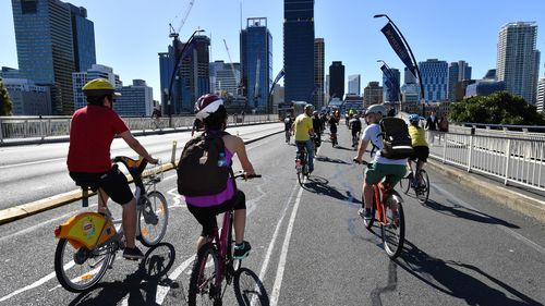 Cyclists rolled onto Victoria Bridge to the strains of the Bee Gees' 'Stayin Alive'. (AAP)