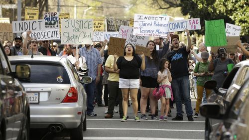 Protestors block an intersection in downtown Sacramento, California, after the funeral for Stephon Clark. (AAP)