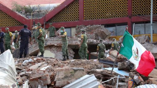 Soldiers remove debris from a partly collapsed municipal building felled by a massive earthquake in Juchitan, Oaxaca state, Mexico. (AP)