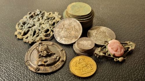 A collection of incredible relics, including an 1895 gold sovereign, found by Rhys Hall in the Perth Hills.