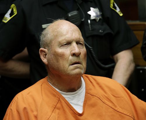 Joseph James DeAngelo, 72, who authorities suspect is the so-called Golden State Killer responsible for at least a dozen murders and 50 rapes in the 1970s and 80s, is wheeled out of the courtroom after his arraignment.