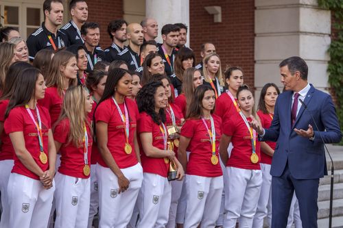 Spain's acting Prime Minister Pedro Sanchez speaks next to Spain's Women's World Cup soccer team after their World Cup victory, at La Moncloa Palace in Madrid, Spain, Tuesday, Aug. 22, 2023.  