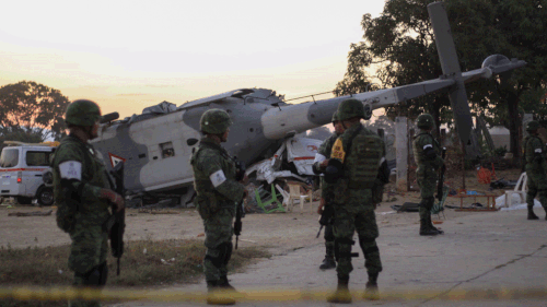 Soldiers guard the helicopter crash scene. (AAP)