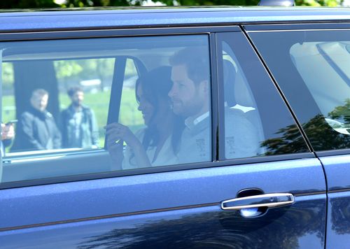 Meghan Markle looks happy and Prince Harry a little nervous as they drive up to Windsor Castle. Picture: Getty