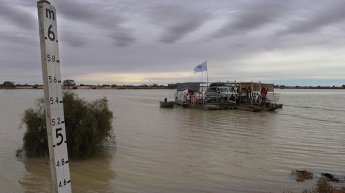 The Copper Creek ferry in operation for the first time in 20 years on the Birdsville Track near the town of Marree in South Australia, Sunday, July 4, 2010