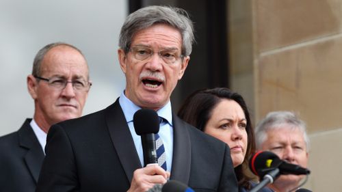 Leader of the State opposition in Western Australia, Mike Nahan addresses gold sector workers protesting outside Parliament House in Perth. (AAP)
