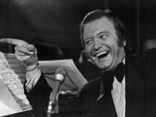 Bert Newton cracks a joke in . October 1977. 