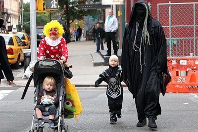 Naomi Watts (left) and Liev Schreiber (right), win the prize for freakiest family costumes at Halloween. Here Alexander, dressed as a mini-Grim Reaper, trick or treats through New York City.