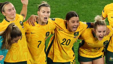 Captain Sam Kerr of Australia speaks to her teammates in the huddle after her team's 2-0 victory against Denmark.