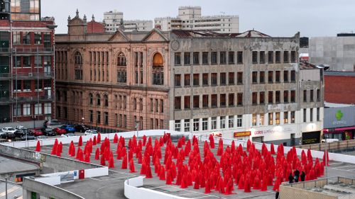 The pop of red contrasted spectacularly against Melbourne's gloomy morning. Picture: AAP