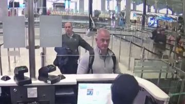 Image from security camera video shows Michael L Taylor, center, and George-Antoine Zayek at passport control at Istanbul Airport in Turkey.