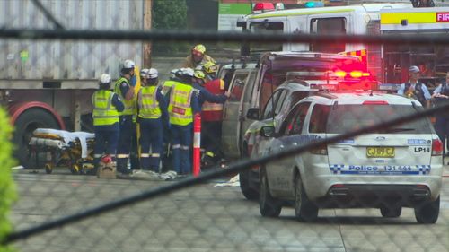 Emergency services called to the workplace on Helles Avenue in Moorebank found the man dead at the scene and another injured passenger.