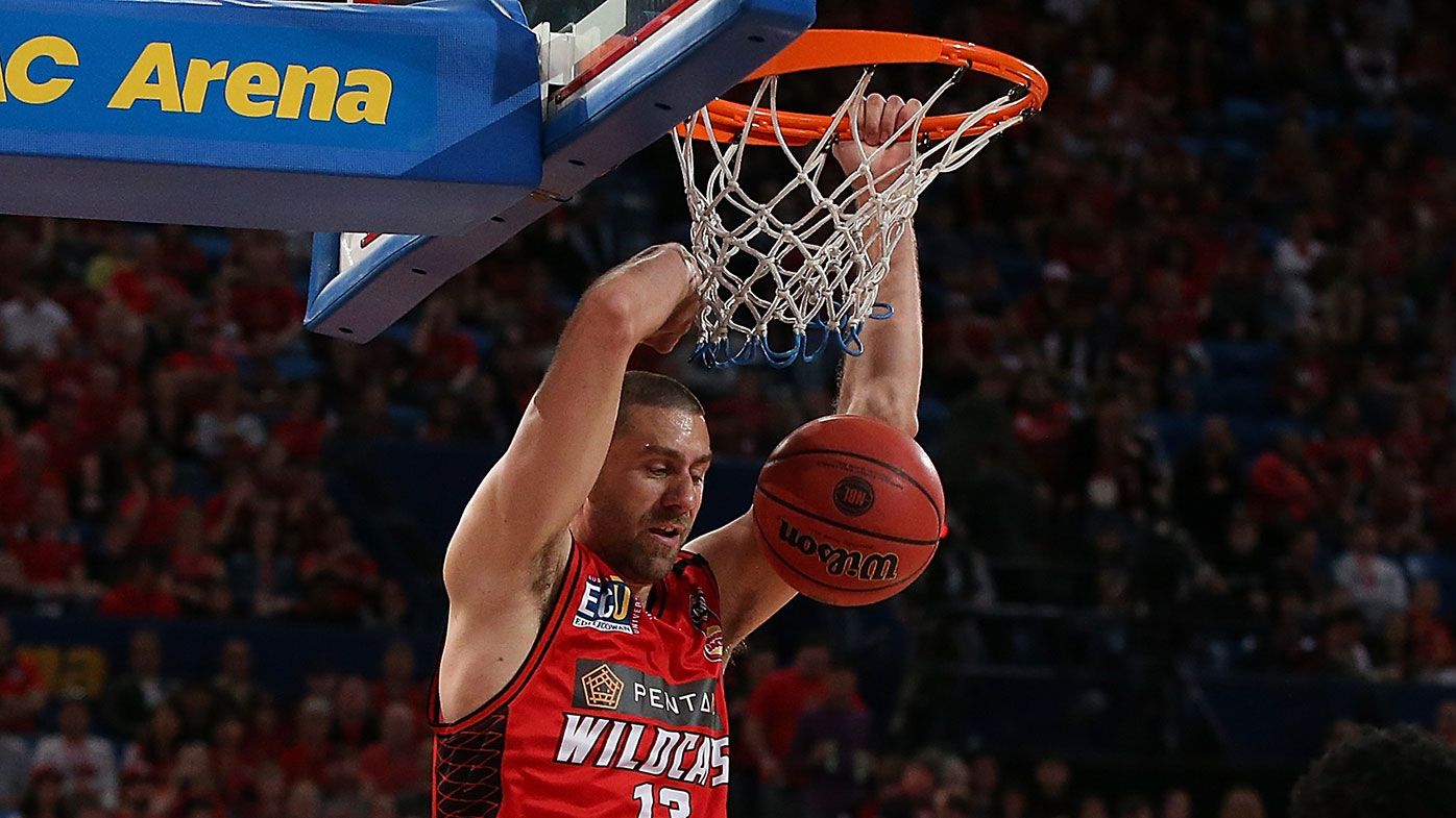 Tom Jervis dunks during the Wildcats win over the Hawks