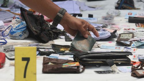 Passports and wallets are among the debris collected following the crash.