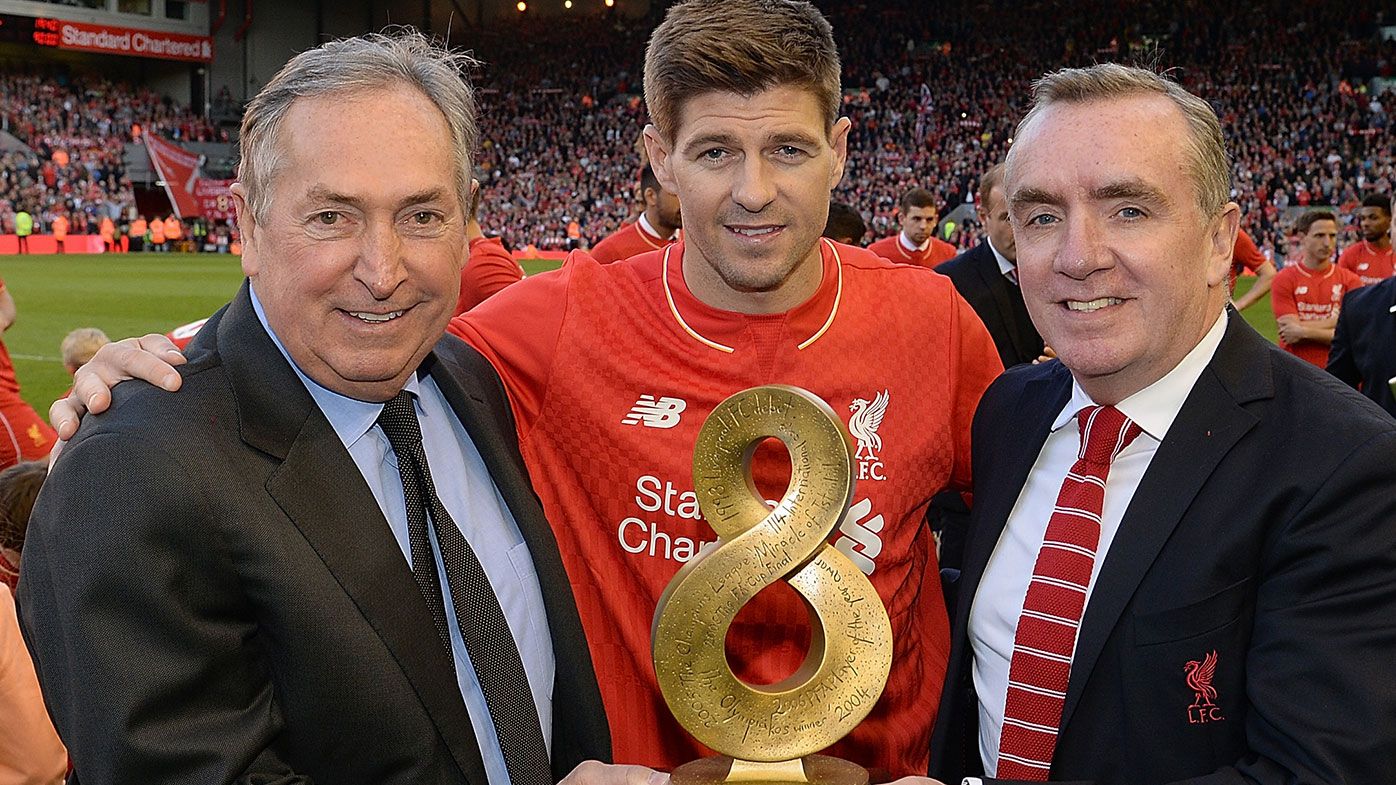 Steven Gerrard of Liverpool receives an award from Gerard Houllier and Ian Ayre Chief Executive of Liverpool FC during the Barclays Premier League match between Liverpool and Crystal Palace at Anfield on May 16, 2015 in Liverpool
