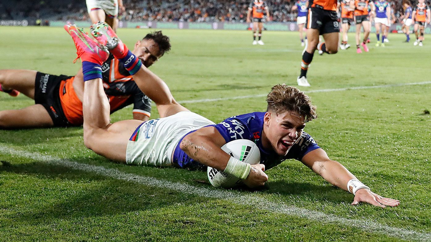 Reece Walsh of the Warriors scores a try during the round 11 NRL match between the New Zealand Warriors and the Wests Tigers at Central Coast Stadium on May 21, 2021, in Gosford, Australia. (Photo by Mark Metcalfe/Getty Images)