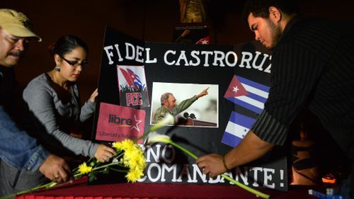 People have converged in Havana to mourn the death of Fidel Castro, while other celebrate the leader's passing in Miami. (AFP)