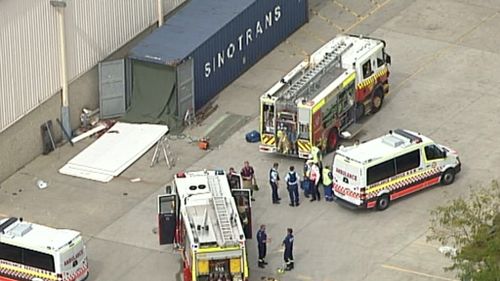 Three men have been injured in a shipping container accident in Wetherill Park. (9NEWS)