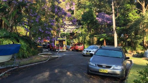 Police and firefighters are still at the scene, four hours after the blaze broke out in the northern beaches house. (9NEWS)