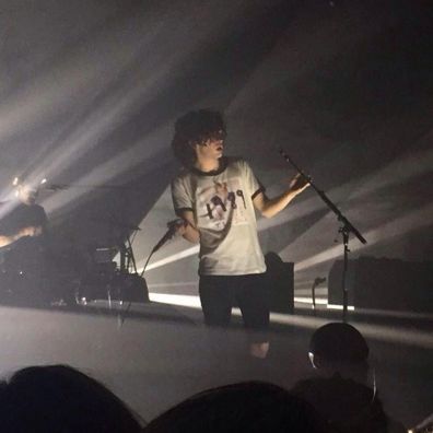Matt Healy wearing a Taylor Swift album cover t-shirt in 2014.