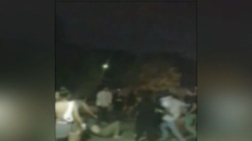 A number of people are seen being knocked to the ground in the violence. (9NEWS)