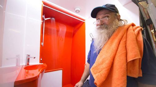 Brisbane homeless man Dave Brum enjoys the new shower facilities. (Orange Sky)