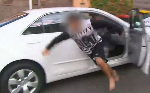 The boy tries to bolt away from authorities. (9NEWS)