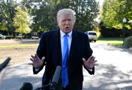 US President Donald Trump speaks to reporters on the South Lawn before boarding Marine One at the White House, on Saturday.