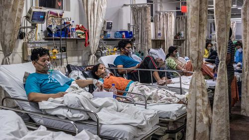 Patients inside the emergency ward of a COVID-19 hospital in New Delhi, India.