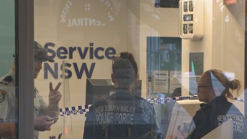 A Service NSW staff member is in hospital after he was stabbed in Sydney's CBD this morning.