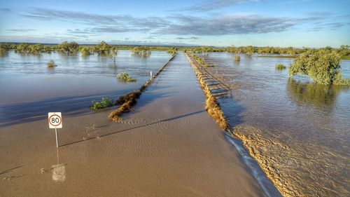 Torrential rains and flash flooding has cut off roads to the Australian Age of Dinosaurs museum in Winton.