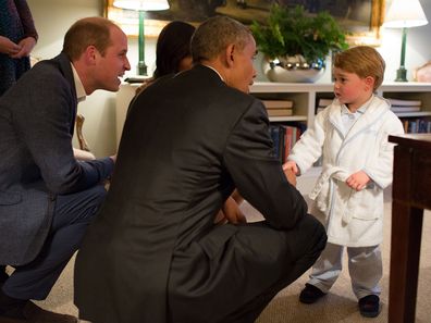 President Barack Obama, Prince William, Duke of Cambridge and First Lady Michelle Obama talks with Prince George at Kensington Palace