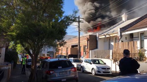 Residents watched on as the blaze tore through the single-level building. Picture: 9NEWS