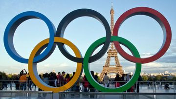 The Olympic rings are set up in Paris, France, in front of the Eiffel Tower.