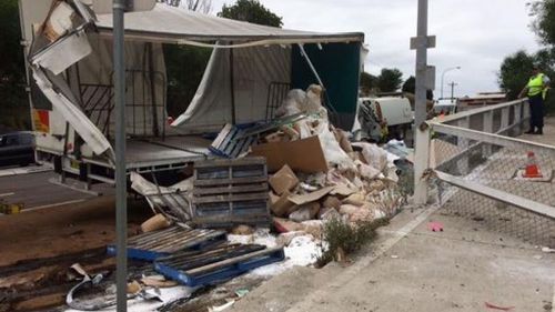 The load of the truck had to be removed for the rescuers to free the trapped police officers. (NSW Police)