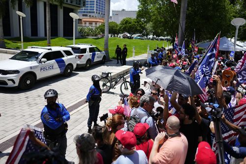 Supporters wait for the arrival of former President Donald Trump at the Wilkie D. Ferguson Jr. U.S. Courthouse, Tuesday, June 13, 2023, in Miami. 