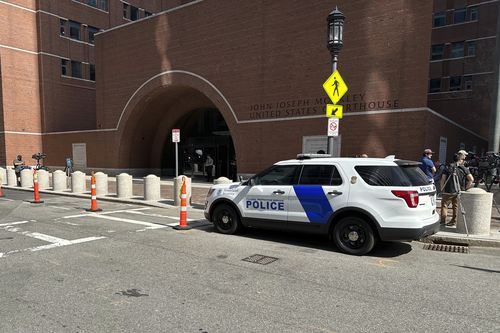 A federal police vehicle is parked outside US District Court in Boston, Mass., Friday, April 14, 2023 as Massachusetts Air National Guardsman Jack Teixeira appears for an initial hearing after being accused of leaking highly classified military documents. 