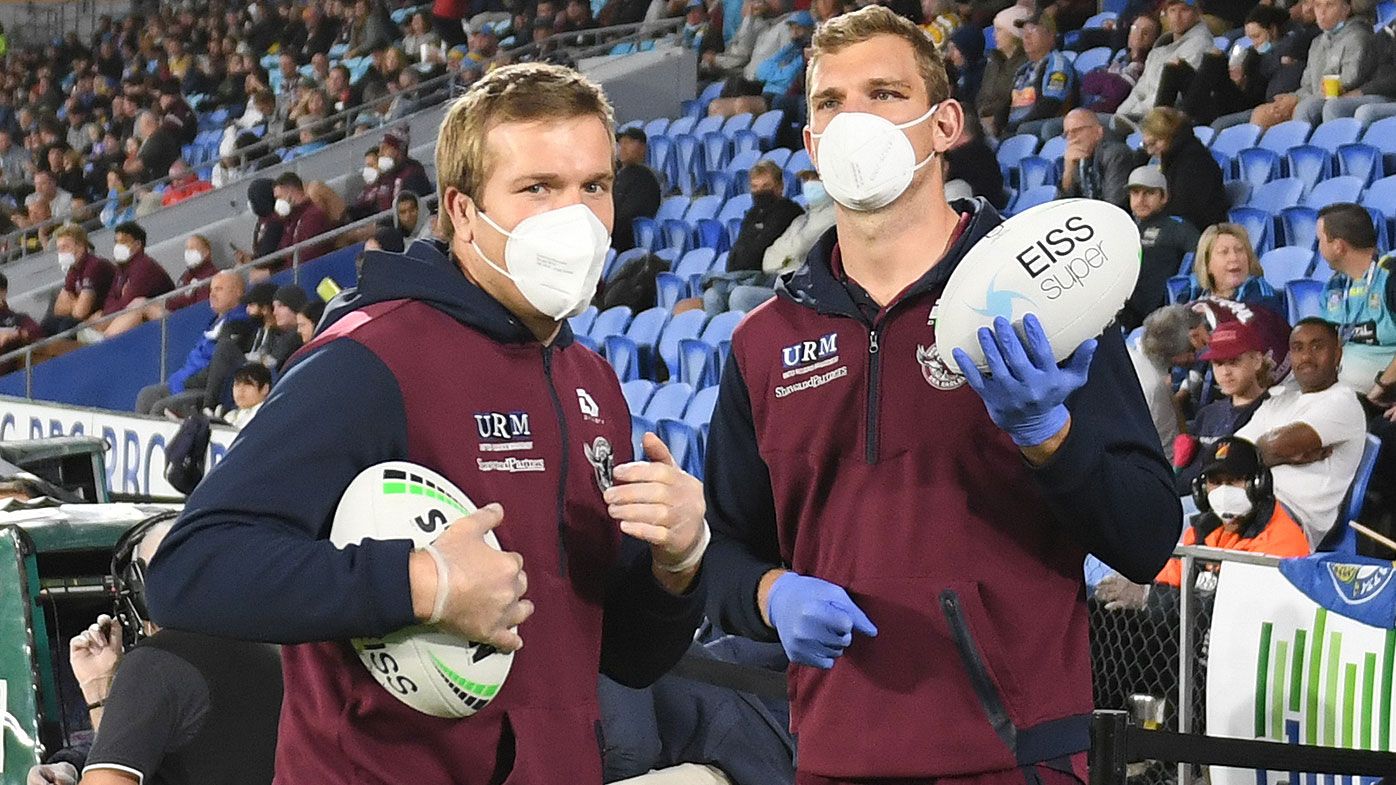 Brothers Jake and Tom Trbojevic act as ball boys during Manly&#x27;s clash on the weekend. 