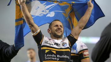 Rob Burrow holds a flag in Manchester, July 10, 2017.