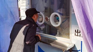 A man undergoes a COVID-19 test in Shanghai